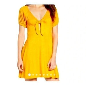 Love,Fire cut out polka dot front tie dark yellow sundress size Medium NWOT